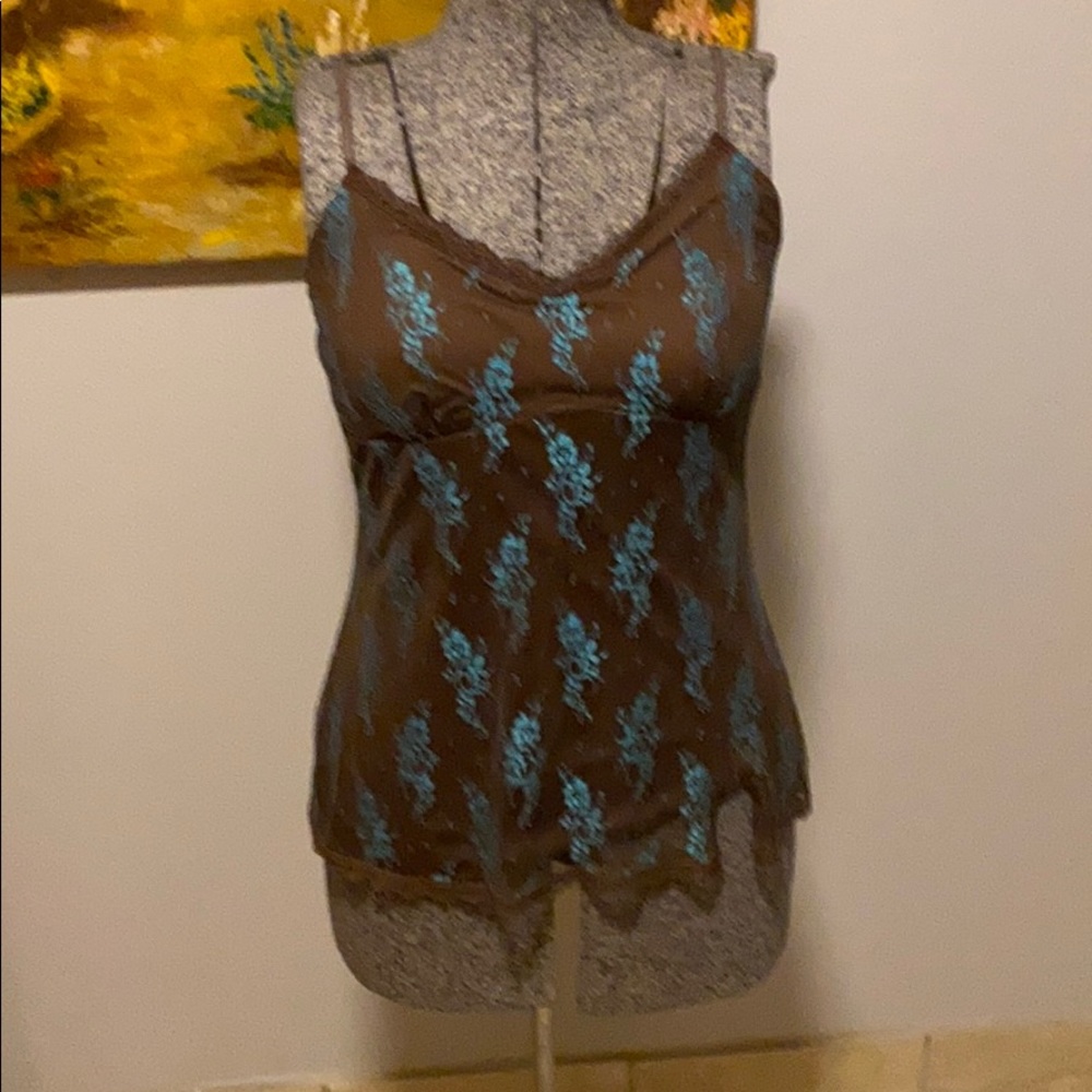 A chocolate brown tank with a lace overlay.